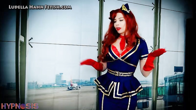 Ludella Hahns Fetish Adventures - Fembot Flight Attendant is on the Fritz