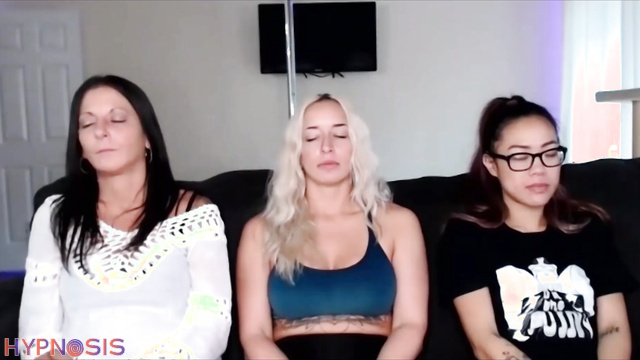 Blonde MILF and Asian girl undress under hypnosis