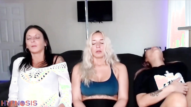 Blonde MILF and Asian girl undress under hypnosis