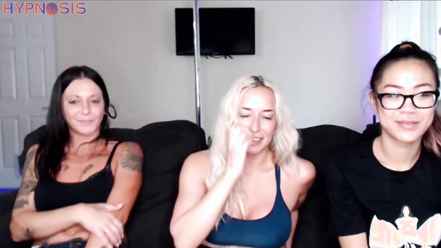 Blonde MILF and Asian girl undress under hypnosis